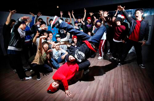 Professional B-Boy performing power move at urban event